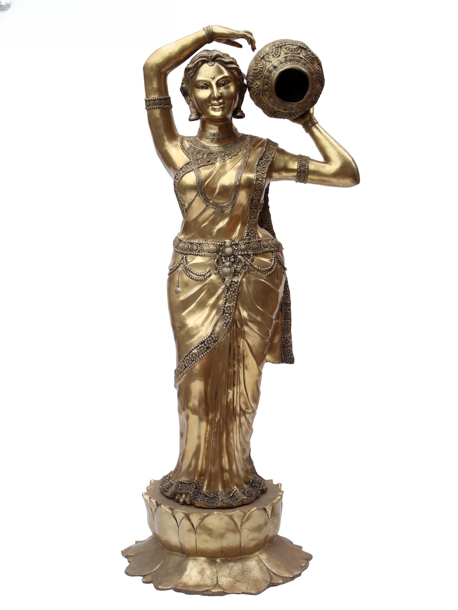 84" Super Large River Goddess Cauvery with Water Feature | Brass Statue: Title: 84" Super Large River Goddess Cauvery with Water Feature | Brass Statue Description: Indian art has long celebrated the imagery of women fetching water, reflecting the cultural significance of 