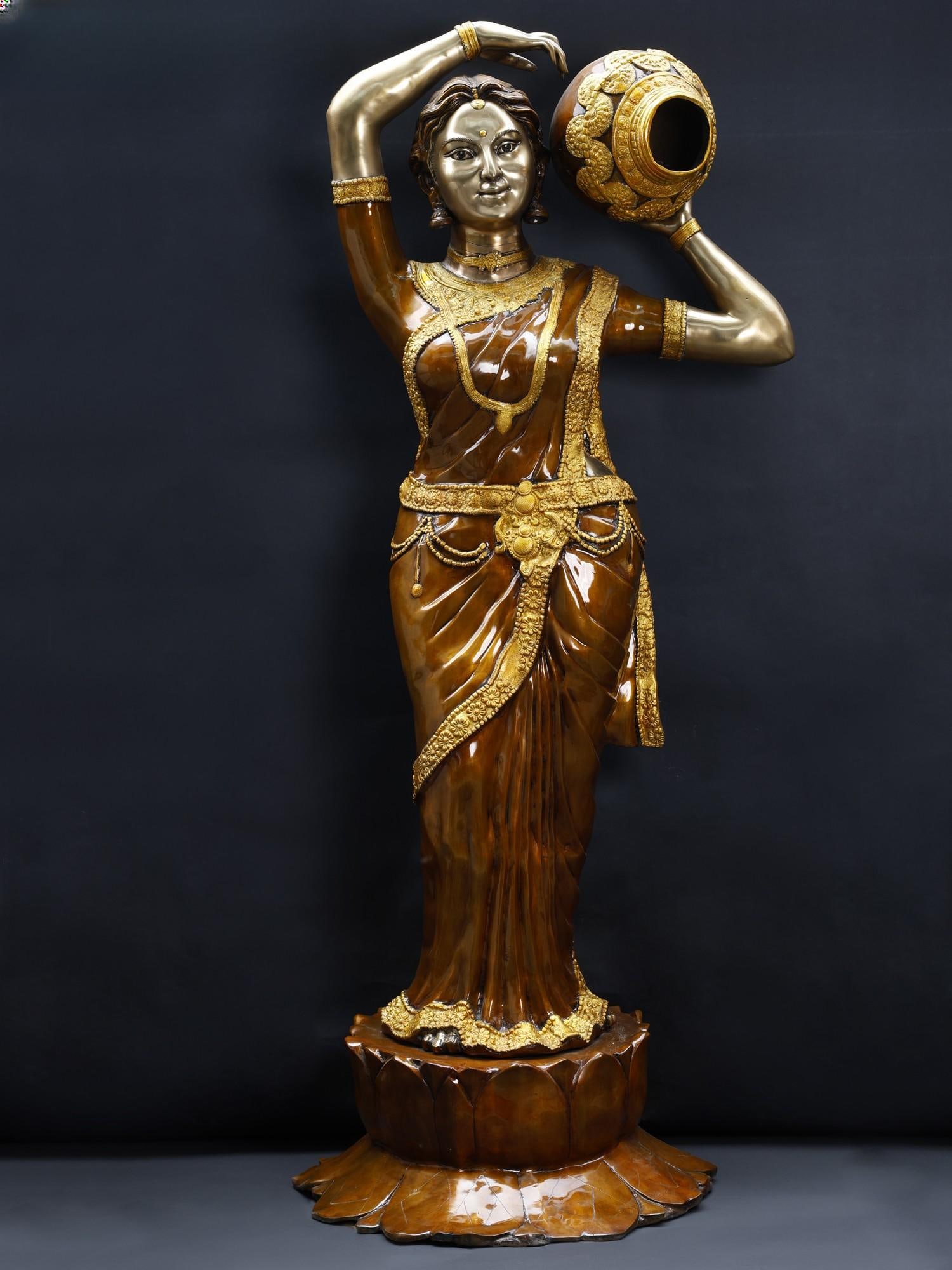 84" Super Large River Goddess Cauvery with Water Feature | Brass Statue: Title: 84" Super Large River Goddess Cauvery with Water Feature | Brass Statue Description: Indian art has long celebrated the imagery of women fetching water, reflecting the cultural significance of 