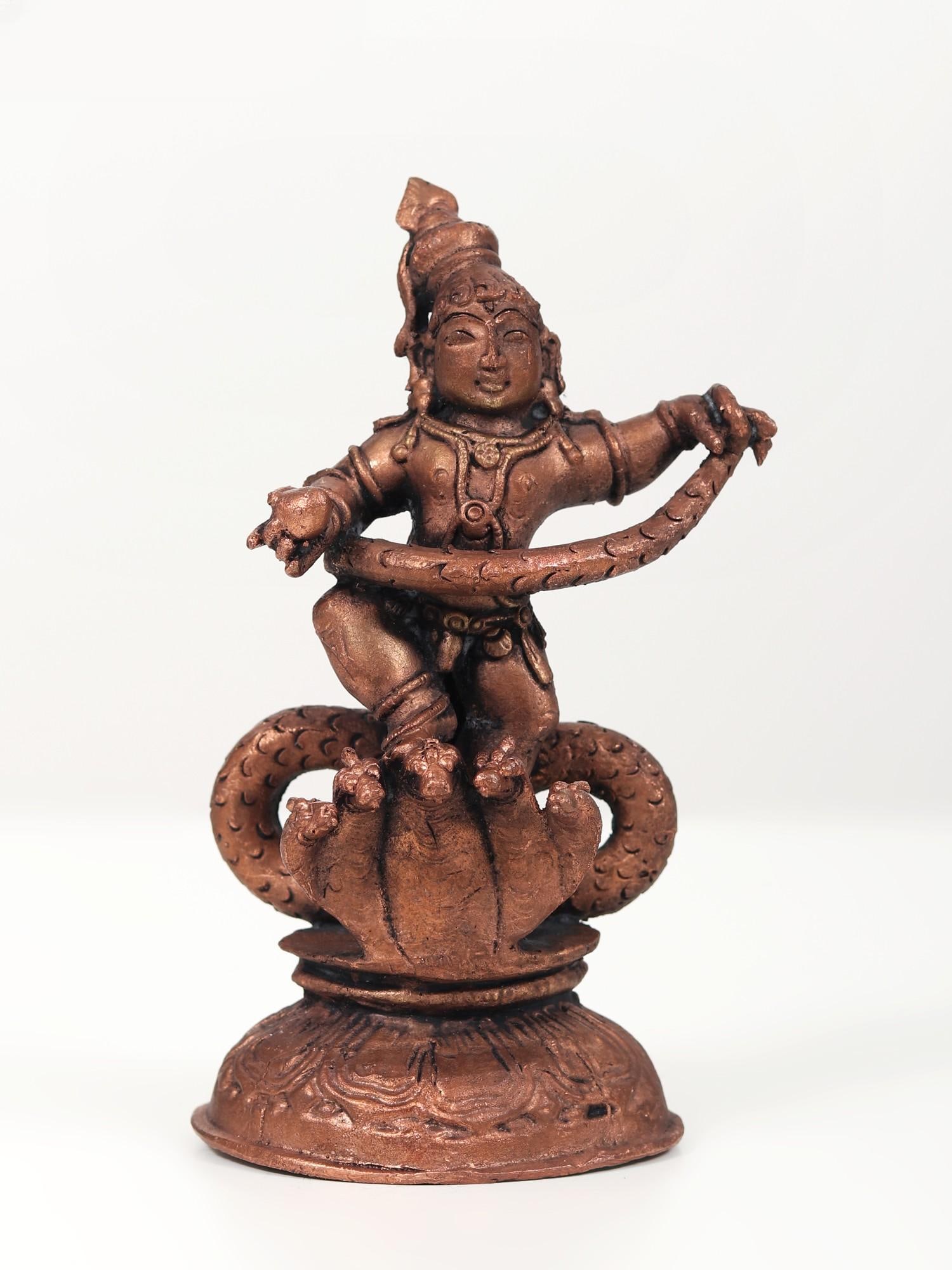 6" Small Kaliya Mardan Krishna | Copper Statue: Title: 6" Small Kaliya Mardan Krishna | Copper Statue Description: In Copper's embrace, Krishna's divine grace unfolds, a masterpiece in miniature, the Small Kaliya Mardan Krishna statue. With celesti