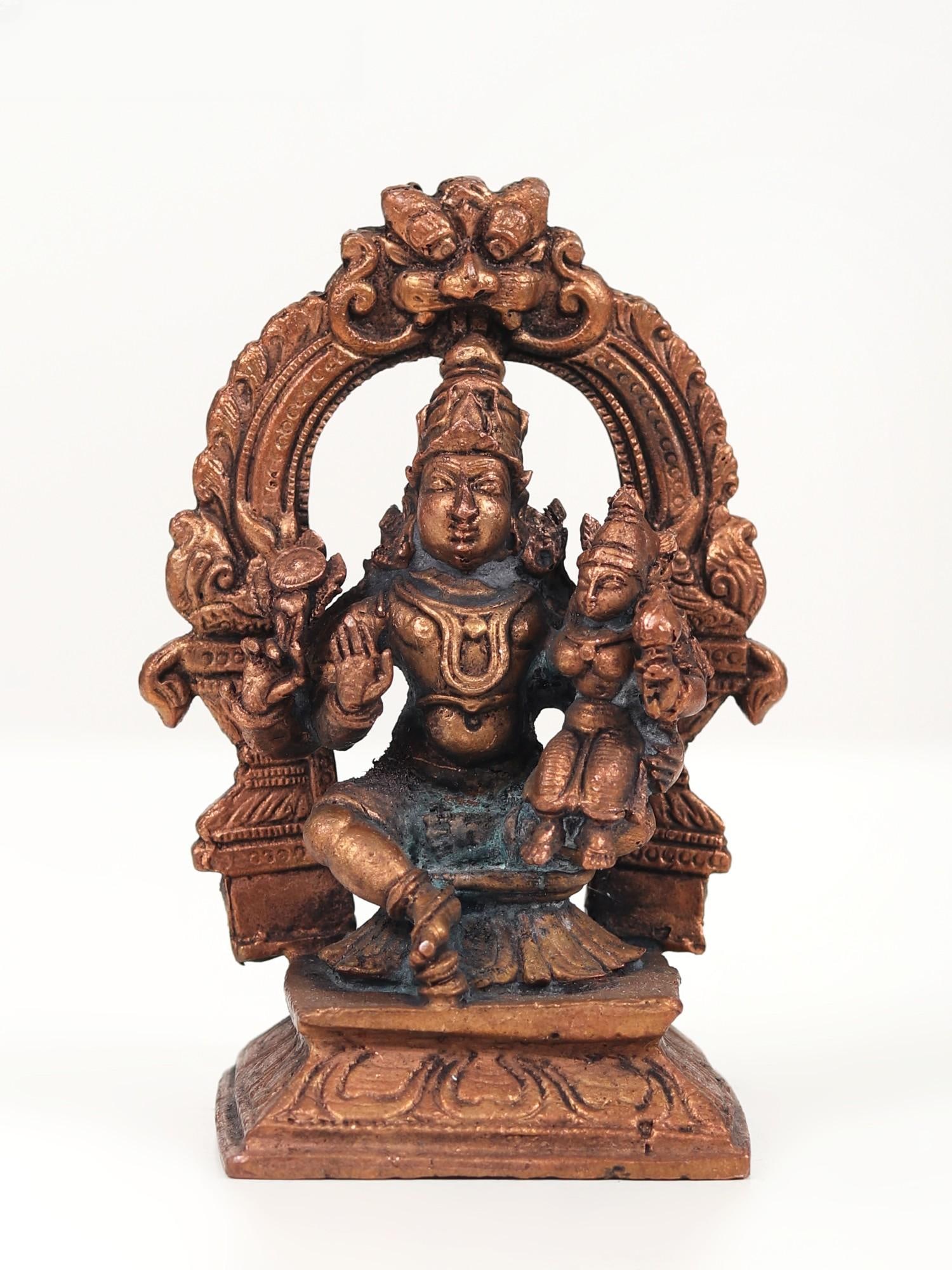 4" Small Lord Vishnu with Devi Lakshmi Seated on Kirtimukha Throne | Copper Statue: Title: 4" Small Lord Vishnu with Devi Lakshmi Seated on Kirtimukha Throne | Copper Statue Description: This Small Lord Vishnu with Devi Lakshmi Seated on Kirtimukha Throne Copper Statue serves as a di