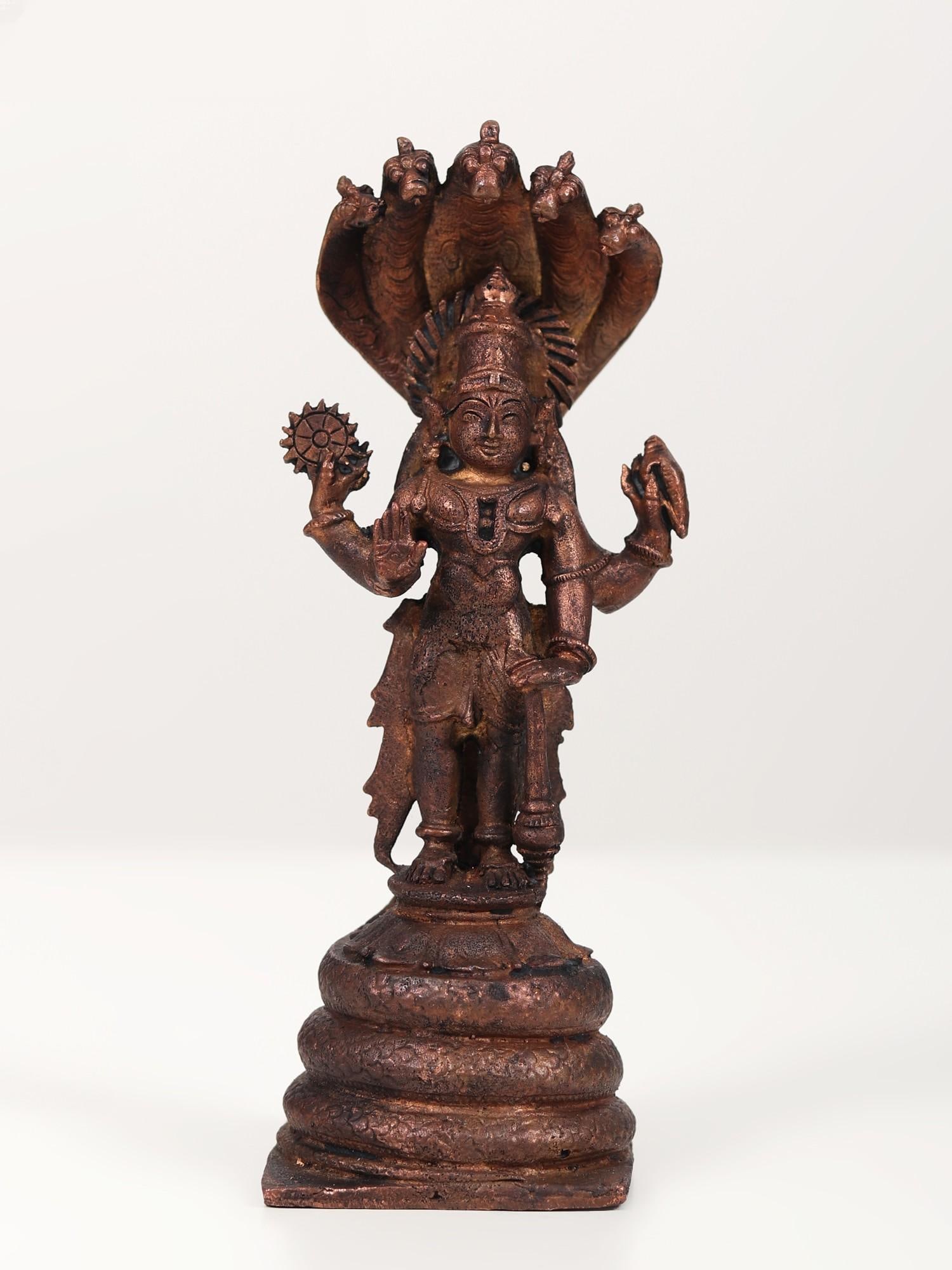 6" Small Lord Vishnu Idol Standing on Sheshnag | Copper Statue: Title: 6" Small Lord Vishnu Idol Standing on Sheshnag | Copper Statue Description: Shesh Naag, Lord Vishnu's favorite, has featured prominently in numerous stories. It served as the rope for the Sagar