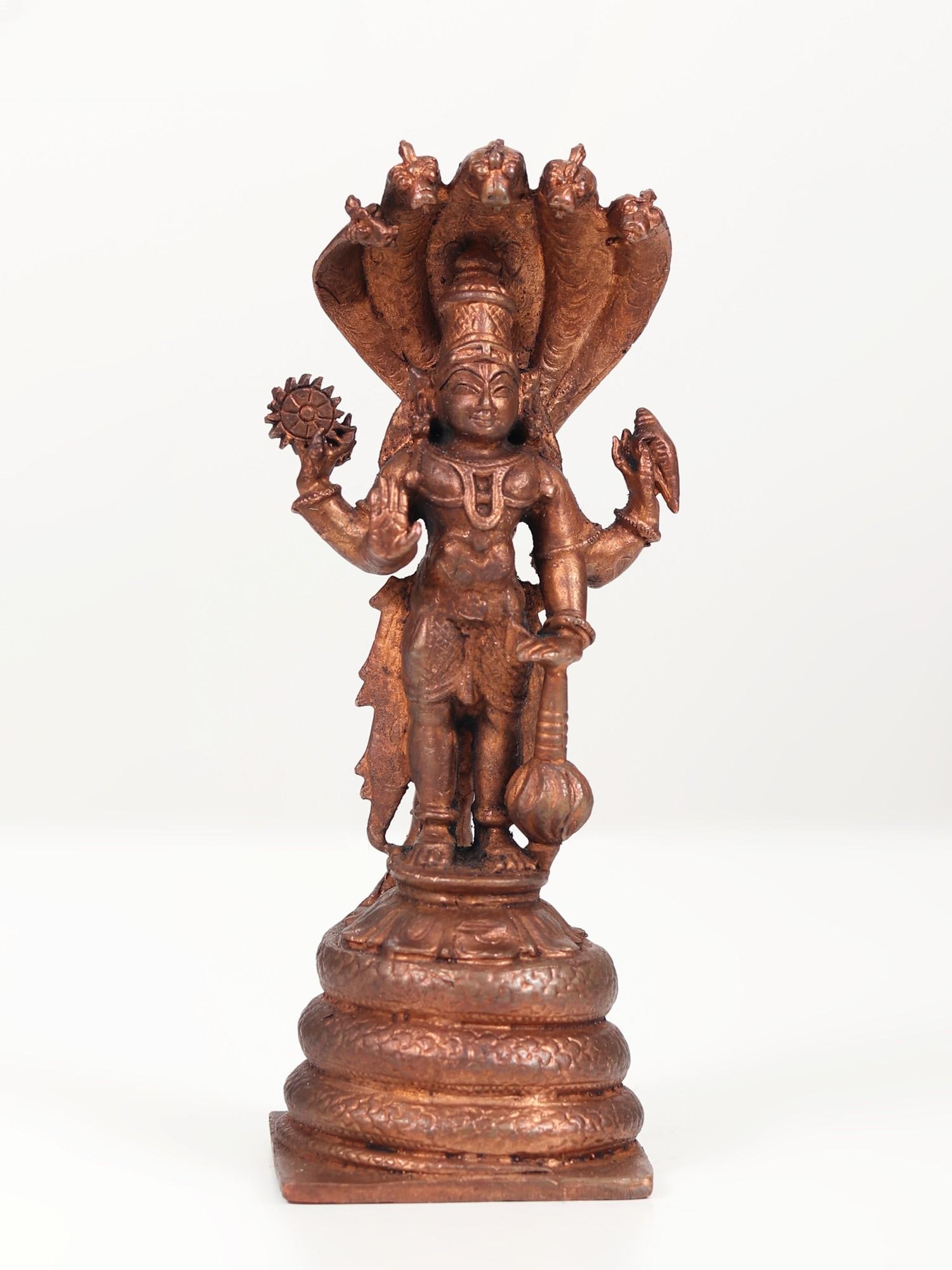 6" Small Blessing Lord Vishnu Idol Standing on Sheshnag | Copper Statue: Title: 6" Small Blessing Lord Vishnu Idol Standing on Sheshnag | Copper Statue Description: Worshipping Lord Vishnu daily is believed to invite prosperity and good luck as Vishnu is considered the pre