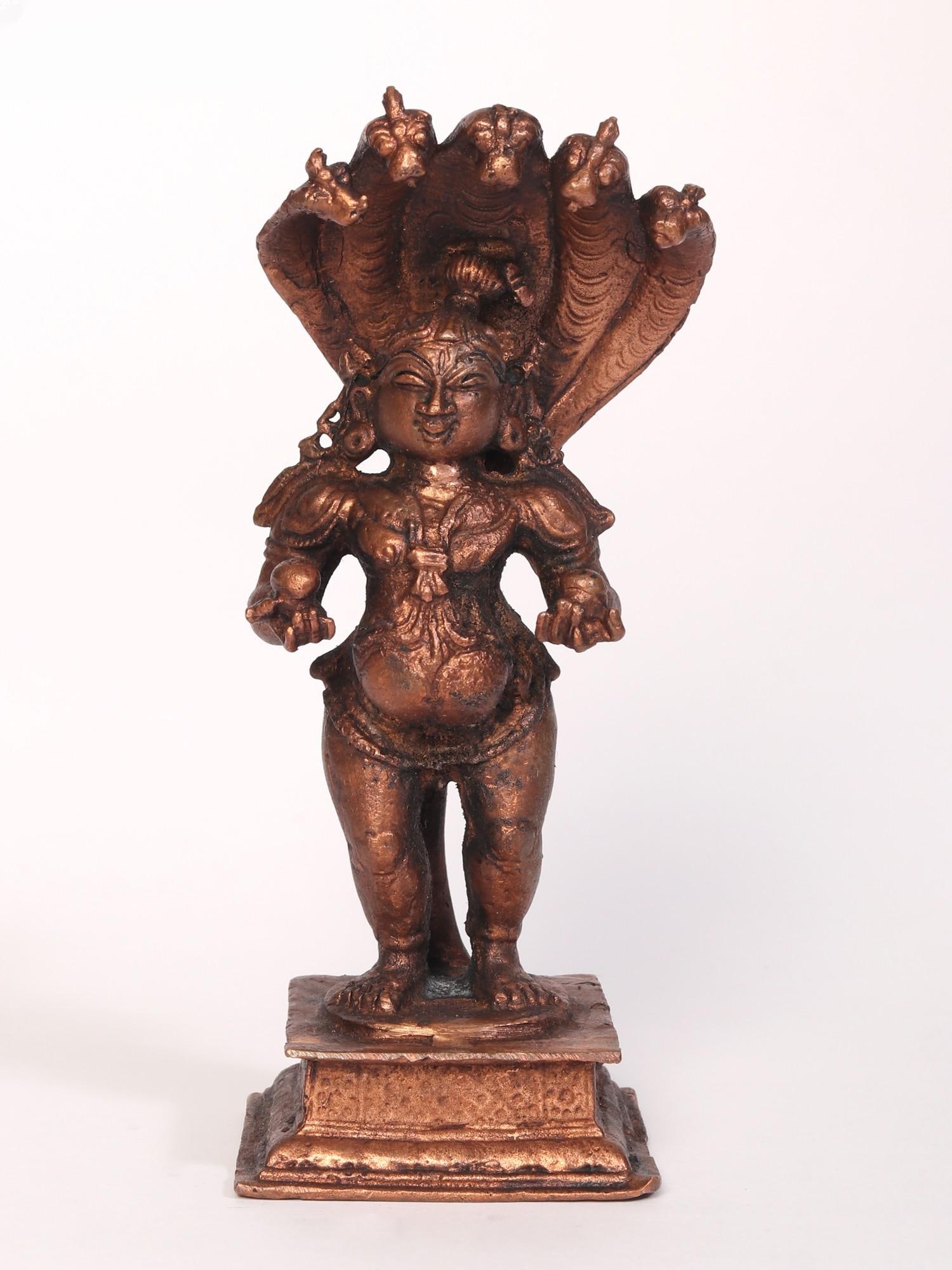 5" Standing Lord Krishna Idol with Protecting Sheshnag | Copper Statue: Title: 5" Standing Lord Krishna Idol with Protecting Sheshnag | Copper Statue Description: This Standing Lord Krishna with Protecting Sheshnag Copper Statue radiates divine elegance and symbolism. Cra