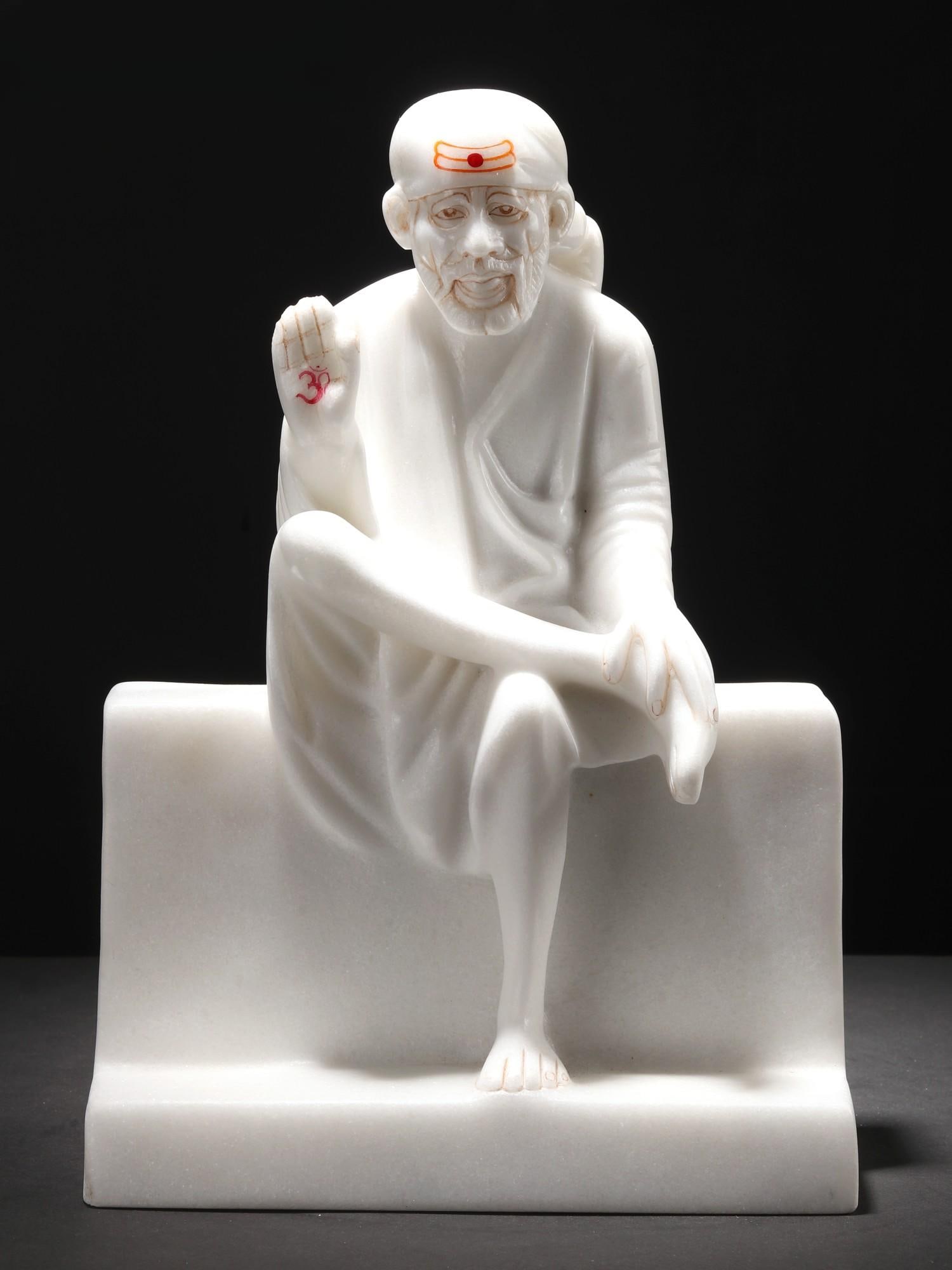 11" Blessing Sai Baba Statue in Vietnam Marble: Title: 11" Blessing Sai Baba Statue in Vietnam Marble Description: Carved with love, this Blessing Sai Baba in Vietnam Marble captures the essence of Sai Baba, a spiritual luminary revered for his ben