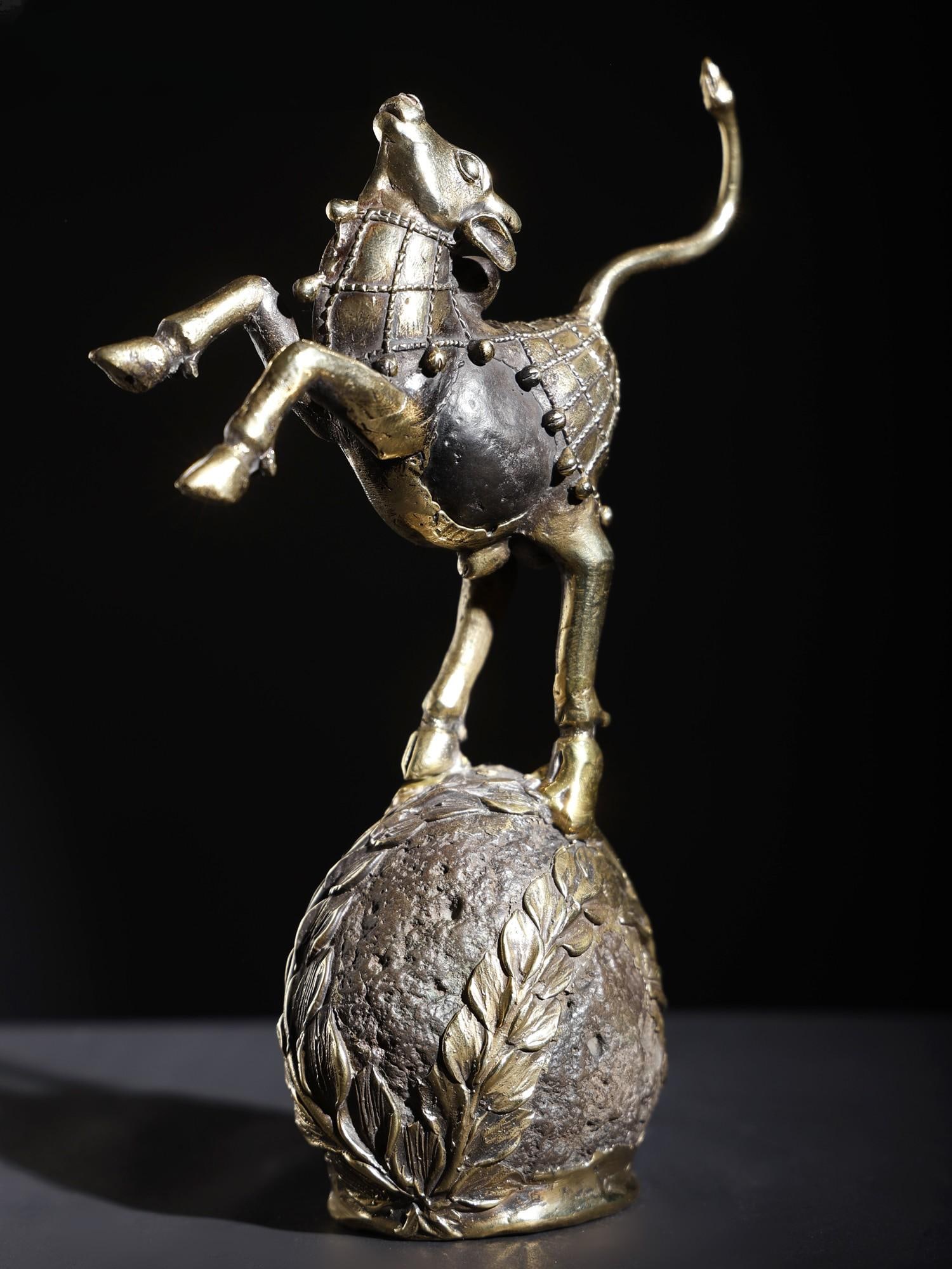 9" Nandi Dancing on The Globe | Brass and Stone Sculpture: Title: 9" Nandi Dancing on The Globe | Brass and Stone Sculpture Description: This Brass and Stone sculpture of Nandi Dancing on The Globe is a significant piece of art that seamlessly blends