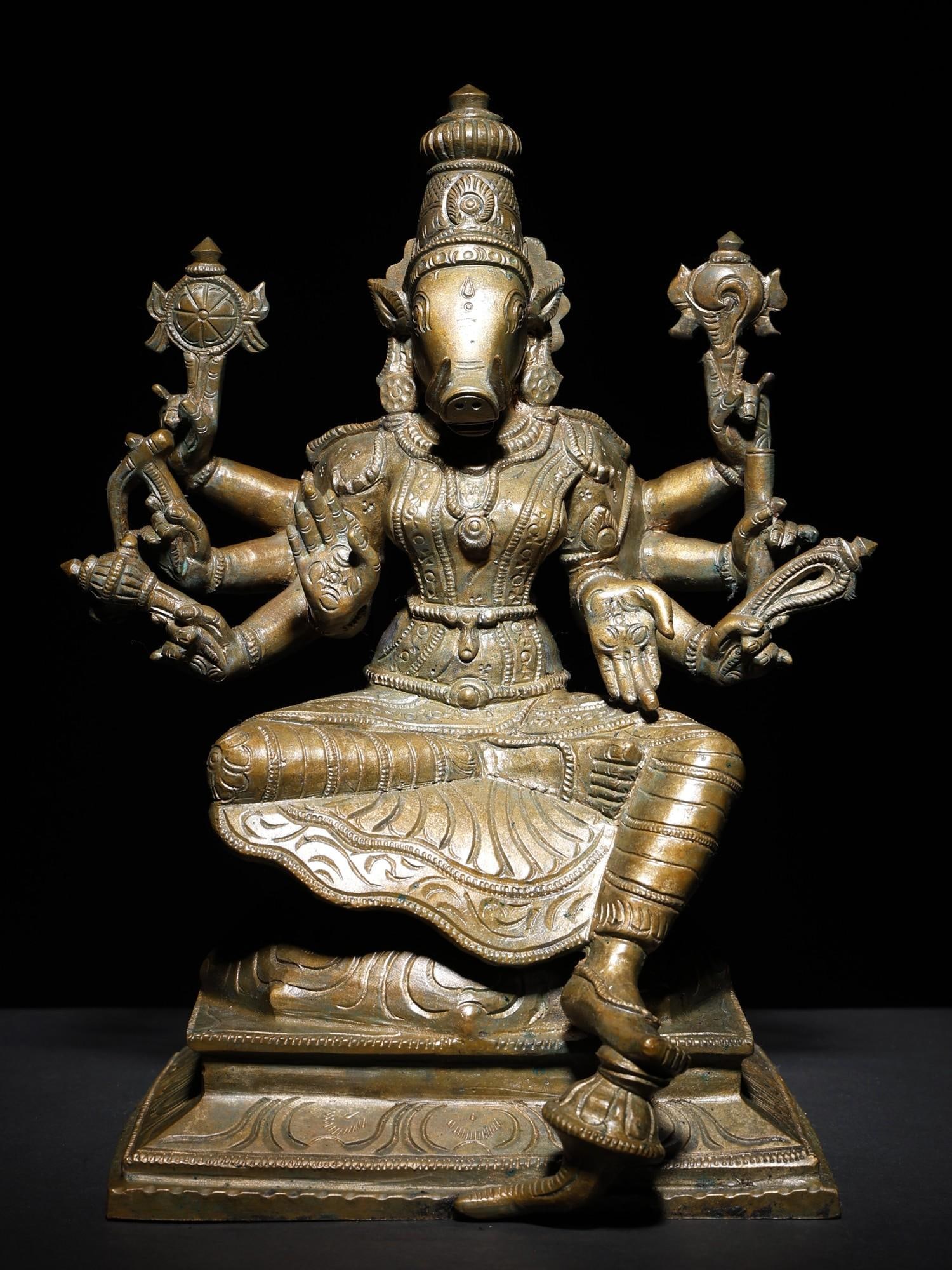 12" Eight-Armed Sitting Goddess Varahi Bronze Statue: Title: 12" Eight-Armed Sitting Goddess Varahi Bronze Statue Description: Ashtabhuja or eight-armed Varahi, is the aspect of the boar-faced Matrika or mother-goddess, as the Shakti of Vishnu-Varaha and
