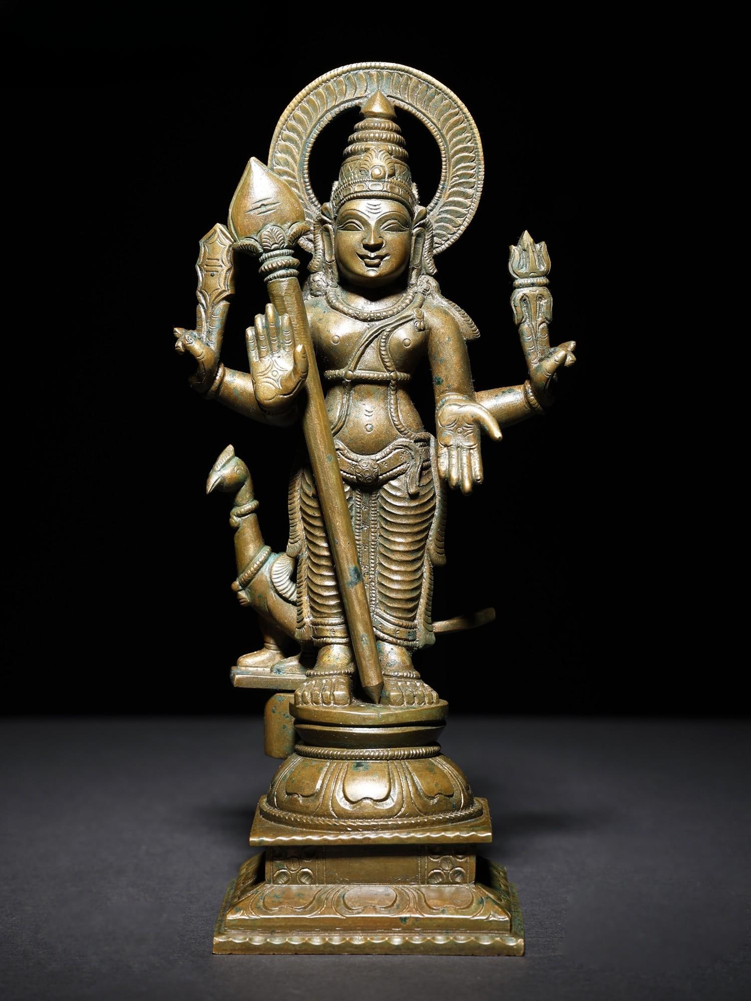 11 " Standing Lord Kartikeya in Blessing Gesture | Murugan Bronze Statue: Title: 11 " Standing Lord Kartikeya in Blessing Gesture | Murugan Bronze Statue Description: The Standing Lord Kartikeya (Murugan) Bronze Statue is a stunning representation of the revered Hindu deity