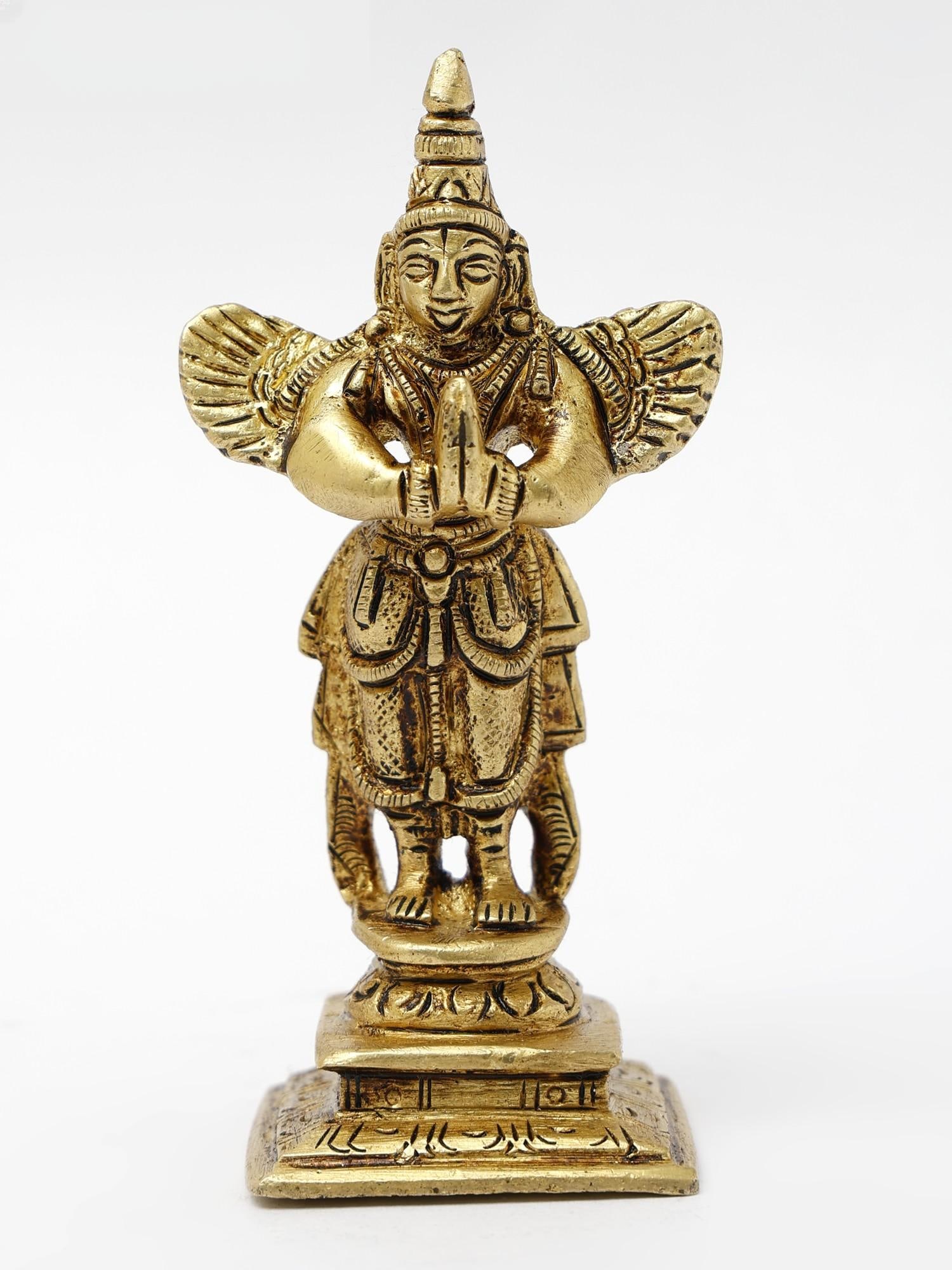 4" Small Standing Garuda Brass Statue in Namaskar Mudra: Title: 4" Small Standing Garuda Brass Statue in Namaskar Mudra Description: This Brass statue of Small Standing Garuda in Namaskar Mudra is a striking representation of Hindu mythology and symbolism.