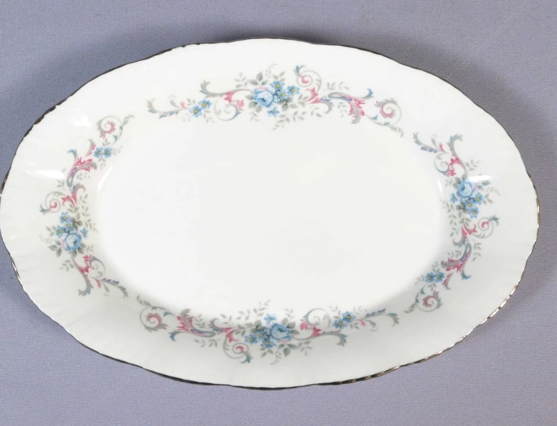 Paragon ROMANCE SANDWICH Snack TRAY Silver Platinum Rim England: This is one exceptional Oval SANDWICH Snack TRAY made by Royal Paragon, England. The tray is in the Romance pattern. It is properly marked with Paragon Backstamp. The tray is 8 1/2" by 5 1/2". It is i