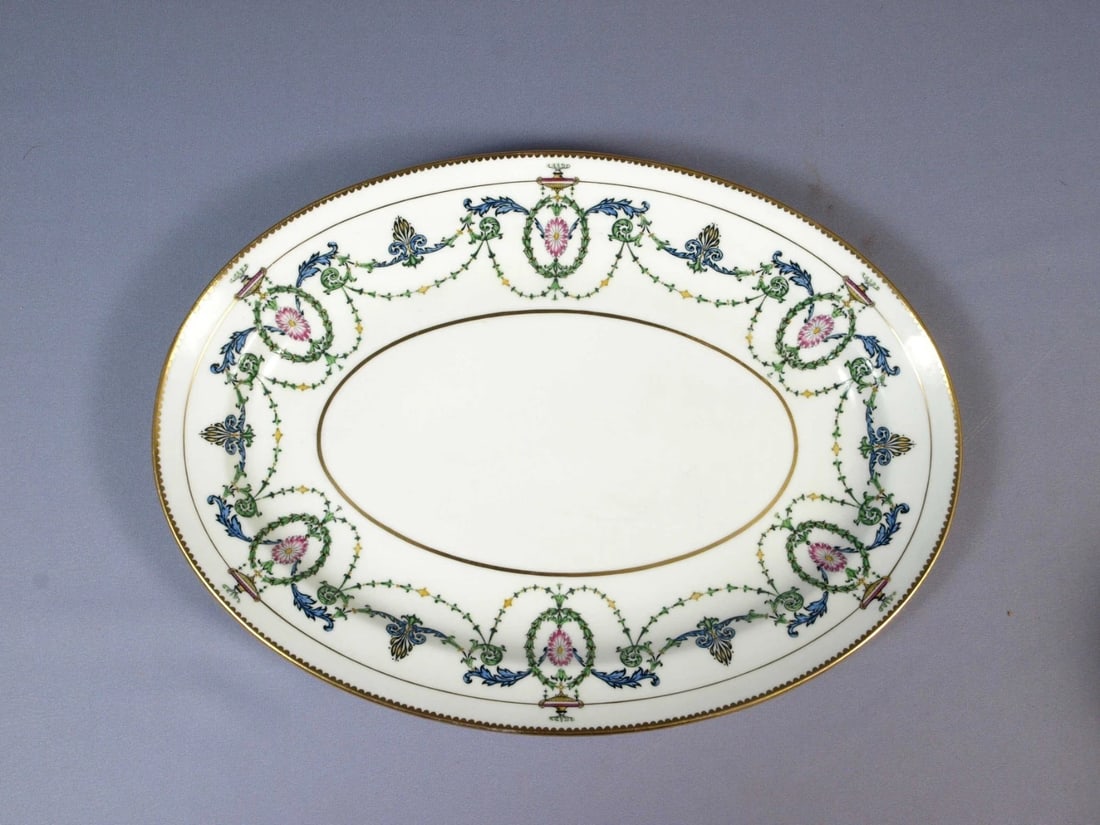 Minton Adam H2581 Oval PLATTER Neoclassical Laurel Wreaths Scrolls ANTIQUE: This is a beautiful and timeless Oval Serving Platter from the famous neoclassical collection by Minton - Made in England. It is in the original Adam Style pattern H2581 that is made in the late