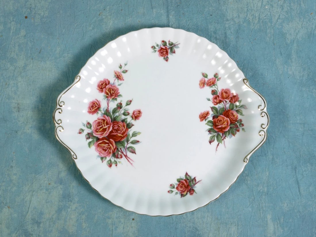 Royal Albert Centennial Rose Handled Round Cake Snack Dessert Platter Dish: This is a gorgeous Bone China Handled Round Cake Snack Dessert Platter Dish, from the famous Centennial Rose collection, made by Royal Albert. This pattern is discontinued. The collection are created