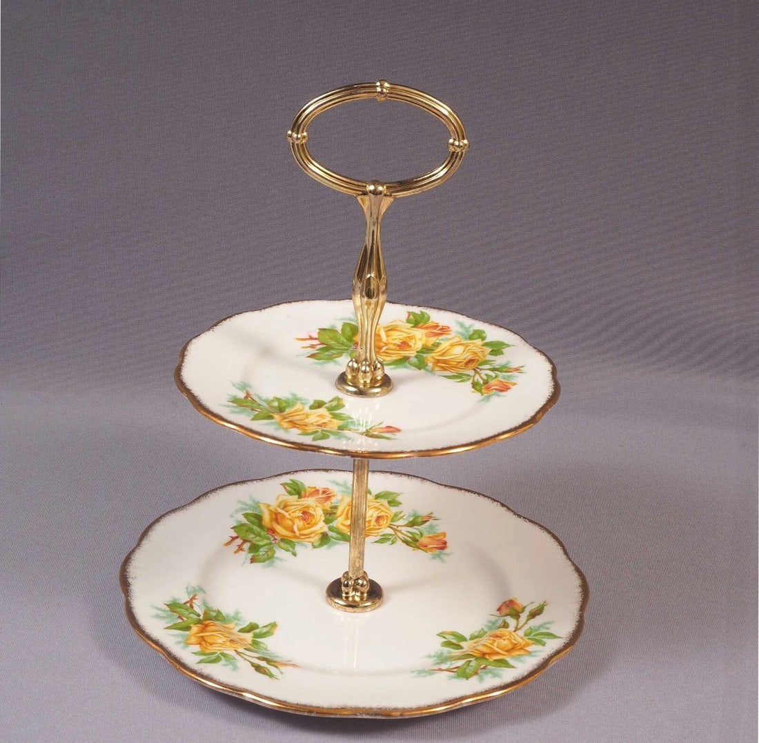 Royal Albert Yellow Tea Rose 2 tier Cake Stand Dish Snack Cookie Tray England: This is a stunning Fine Bone China 2 tier Cake Stand/Cookie Tray, from the famous Yellow Tea rose Collection. The tray is made by Royal Albert in England. It is properly marked with Royal Albert back 