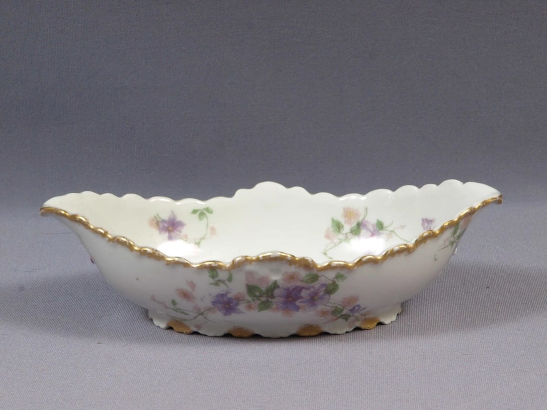 Limoges CHField Haviland GDA France Tray Platter Nut Dish Purple Flowers: This is a vintage Oval Serving Tray/Dish. It is made in CH Field GDA Haviland in Limoges, France. The tray is 8" by 4 1/2" at the rim and 2" deep. It is in good used antique condition with no crazing.