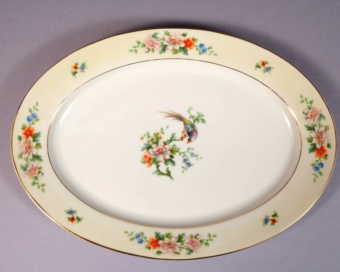 Imperial Heinrich & Co Selb Bavaria Songbird Large Oval Platter Germany: This is a beautiful Large Oval Platter made by Heinrich & Co Selb Bavaria. The platter is in the famous Songbird pattern. The platter has bird and flowers at the center, cream band with flowers and go