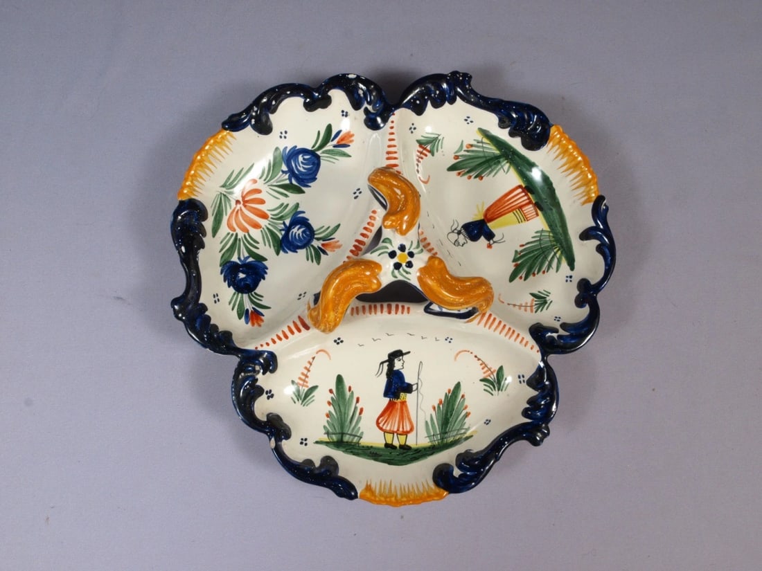 Vintage HENRIOT QUIMPER 3 part Divided Dish Girl France LARGE Faience France: This is a gorgeous Vintage 3-sections serving dish made by Henriot Quimper in France. The earthenware features a decor of flowers and people in traditiona French outfits. The dish is 10 1/2" across.