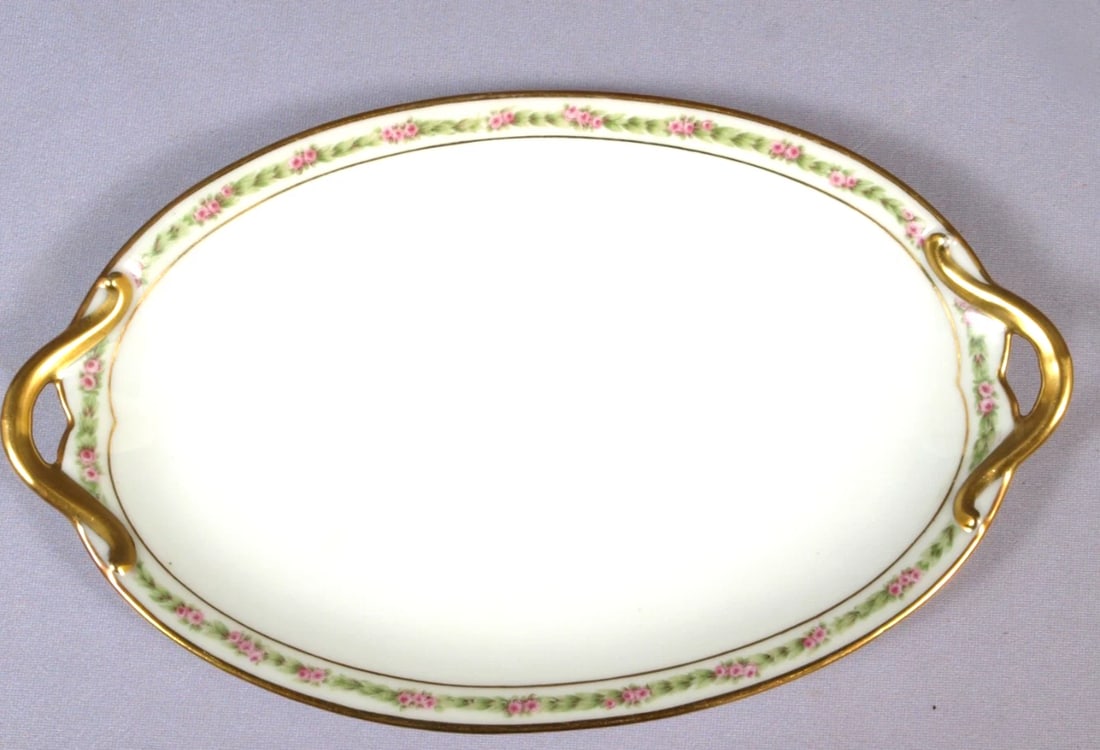 Limoges France CH Field Haviland GDA Small Oval Platter Rose Garland CHF404: This is a gorgeous oval serving platter made in Limoges, France by GDA CH Field Haviland. The pattern features pink roses. The patterns possibly is Rose Garland. The platter is 9 5/8" with the handles
