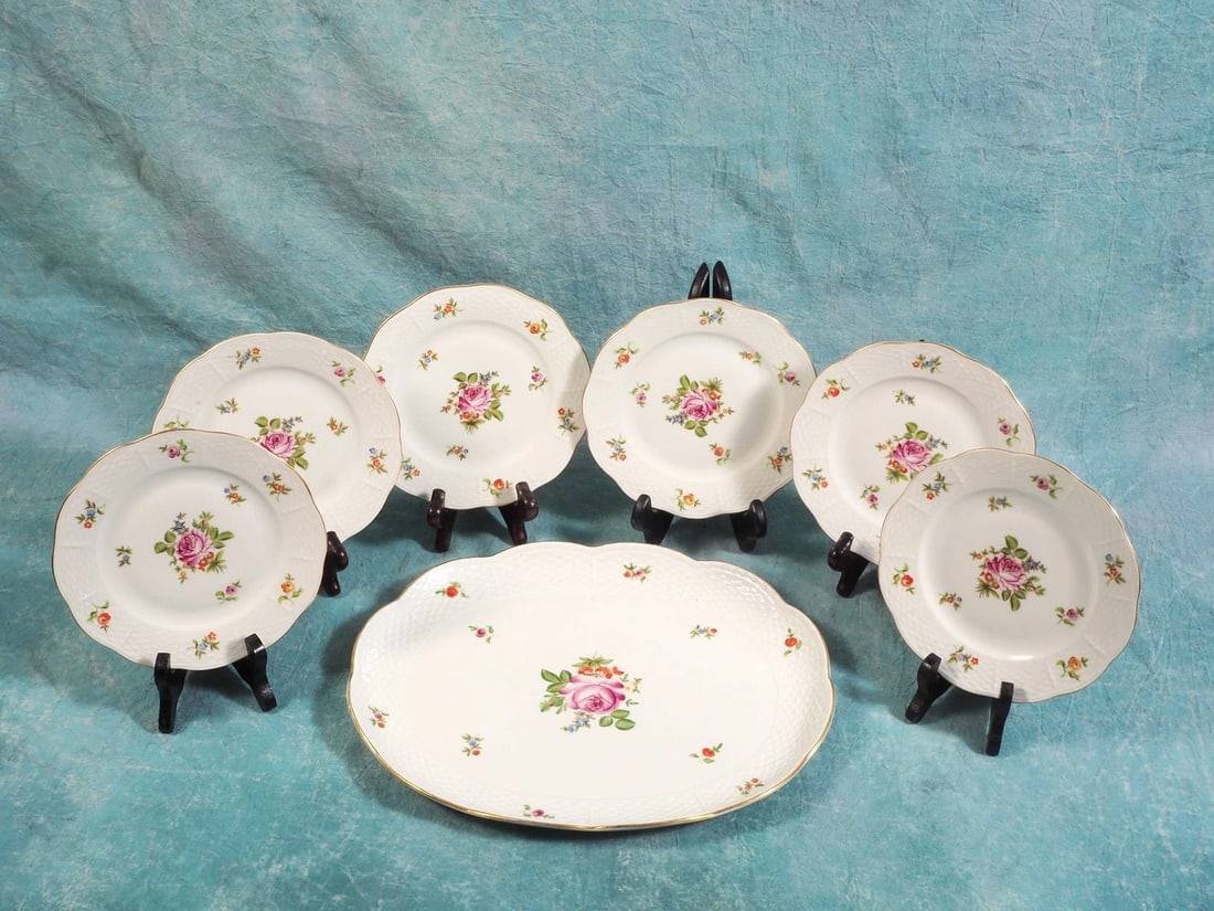 HEREND Hungary Rare Vintage Dessert Plates with Oval platter Porcelain: This is an exceptional Dessert set for six with a serving platter made by Herend in Hungary. The set features a bouquet of flowers and roses in the center and scattered flowers around the embossed lac