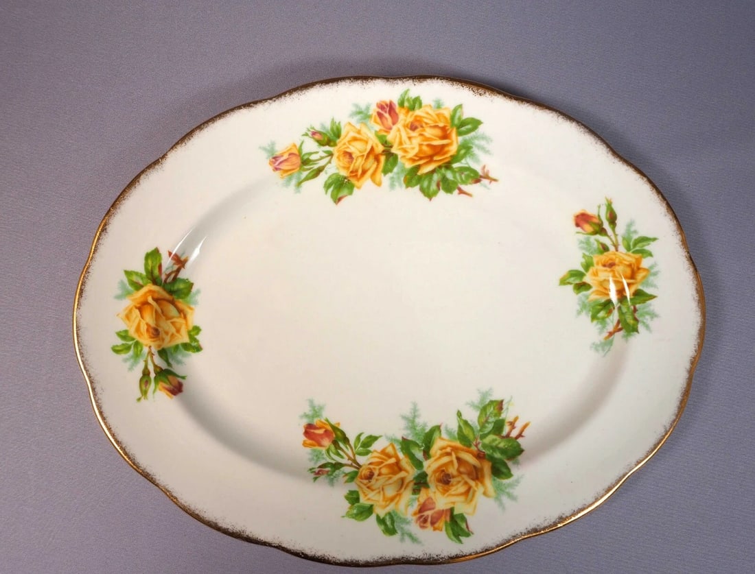 Royal Albert Yellow Tea Rose Bone China Oval Serving Platter England: This very rare and absolutely stunning Fine Bone China Oval Serving Platter, from the famous Yellow Tea rose Collection. The plater is made by Royal Albert in England. It is properly marked with Royal