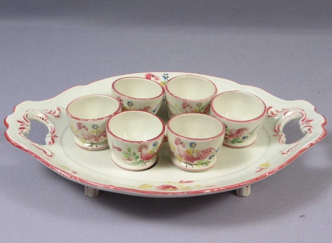 UNIQUE K&G Ket G Luneville France Blue EGG CUP Serving Dish Faience Hen: This is an unique and hard to find EGG Cup Serving Dish. The dish was made in France by K&G . It was made around 1890s. It is faience. The pattern features pink flowers and hens/roosters. It is a