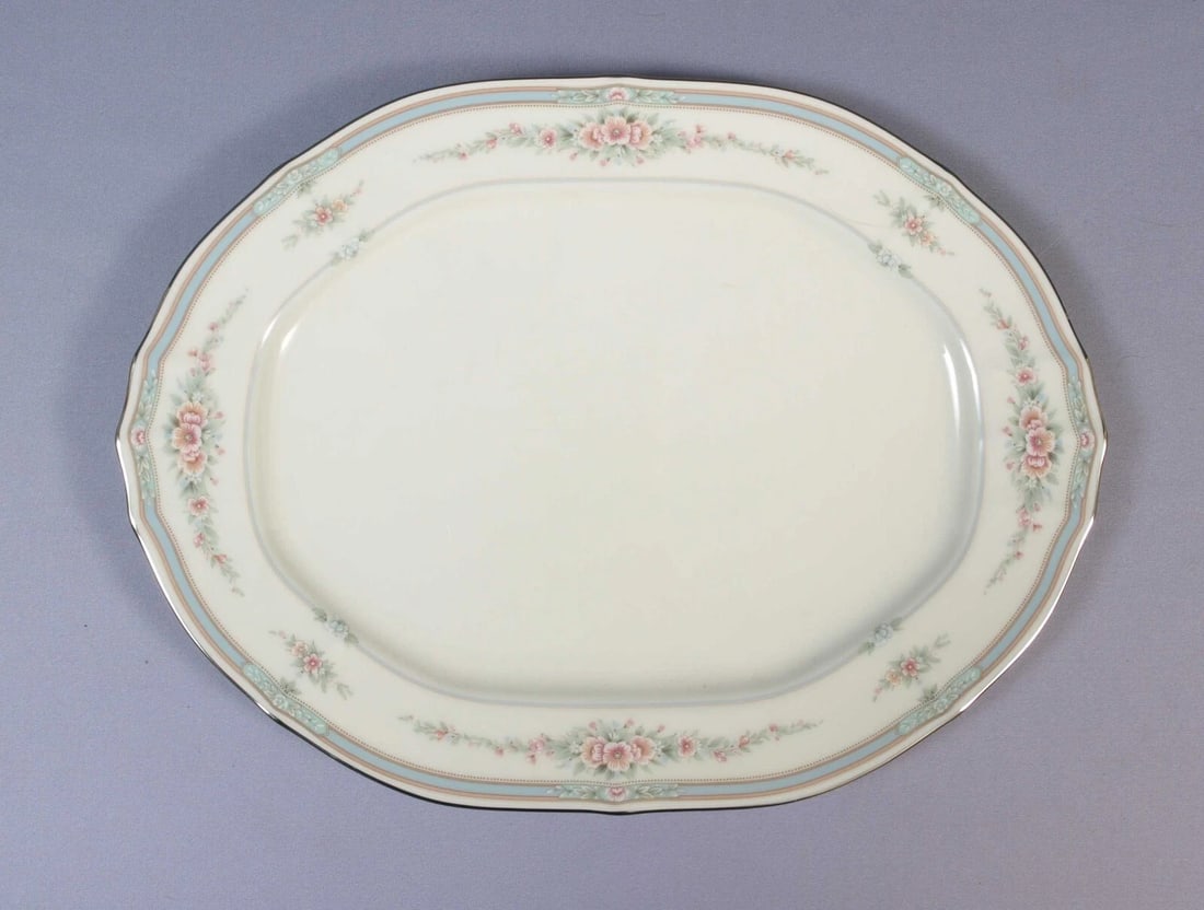 NORITAKE ROTHSCHILD Oval Serving Platter Silver Platinum NEW: This very beautiful Oval Serving Platter is made by Noritake in Rothschild pattern. The pattern was introduced around late 1980s. The pattern has blue and pink flower and Silver/Platinum rim. The plat