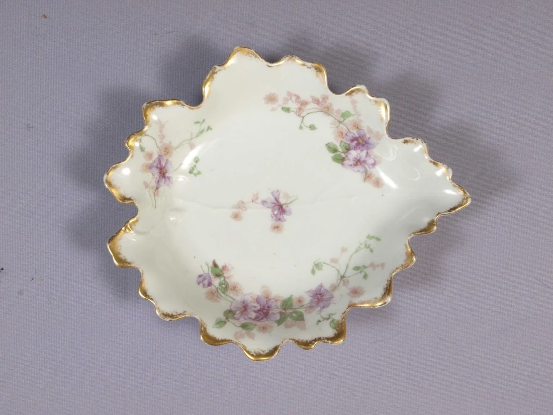 Limoges CHField Haviland GDA France Tray Platter Nut Dish Leaf Purple Flowers: This is a vintage Leaf shaped Serving Tray/Dish. It is made in CH Field GDA Haviland in Limoges, France. The tray is 6 3/4" by 5 3/4" at the rim. It is in good used antique condition with no crazing. 
