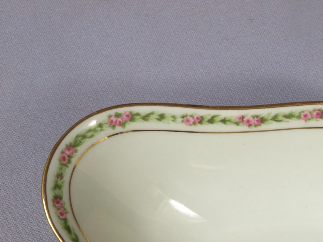 Limoges France CH Field Haviland GDA Bonbon Nuts Dish Tray CHF404 Rose Garland: This is a gorgeous small oval Bonbon/Nut Serving Dish/Tray made in Limoges, France by GDA CH Field Haviland . The pattern features pink roses. The patterns possibly is Rose Garland. The tray is proper