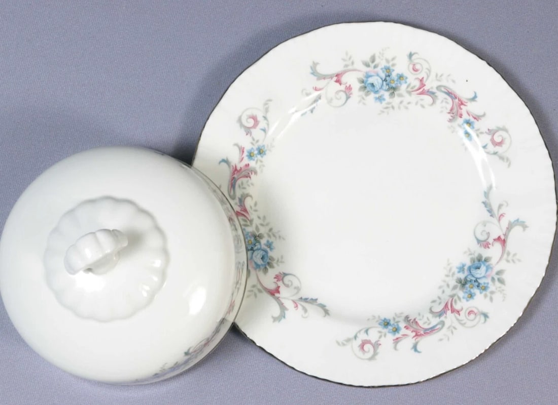 Paragon ROMANCE Butter Dish Domed Lid Under Plate Silver Platinum Rim England: This is a gorgeous Bone China Butter Dish with detached underplate made by Royal Paragon, England. The dish is in the Romance pattern. It is properly marked with Paragon Backstamp. The underplate is