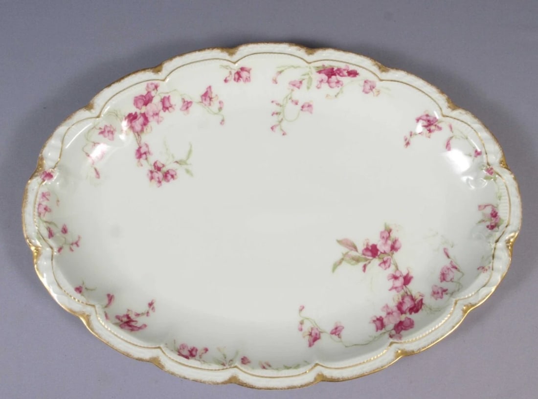 Limoges France HAVILAND Oval Platter J.J.Harte Amsterdam Pink Iris Sweet Pea 16": This is a rare and gorgeous Oval Serving Platter, made in Limoges, France by Theodore Haviland. It is made explicitly for J. J. Harte. It has pink flowers and vines. The platter is 16 3/8" by 11 3/4" 