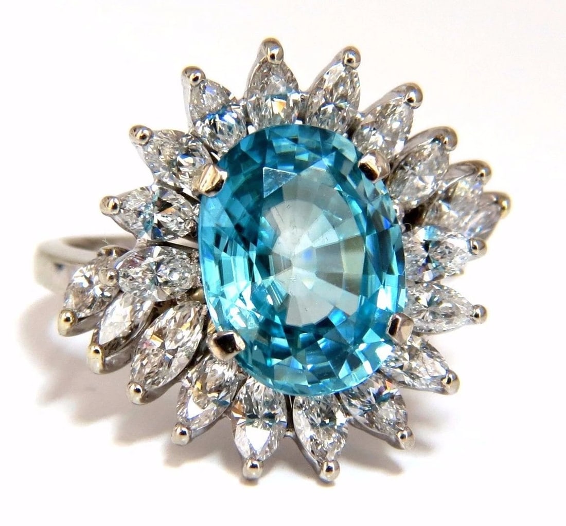 7.70ct Natural Indigo Blue zircon Diamonds Ring 18kt**: Title: 7.70ct Natural Indigo Blue zircon Diamonds Ring 18kt** Description: Indigo Blue Natural Zircon 5.70ct. Natural Blue Zircon Oval cut 11.9 X 9mm VS Clean Clarity, Transparent 2.00ct Side Full cut