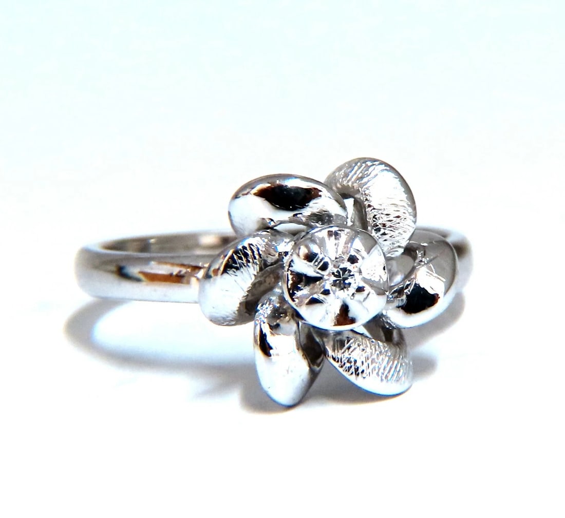 .02ct Natural Diamond Circular Bow Clover Ring 14kt**: Title: .02ct Natural Diamond Circular Bow Clover Ring 14kt** Description: .02ct Natural Diamond Raised Bow ring Durable Built. 14kt white gold. 2.9 Grams Overall ring: 10mm diameter Depth: 7.5mm