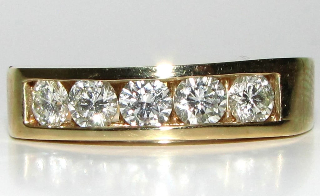 1.00ct DIAMONDS BAND RING 14KT CLASSIC CHANNEL**: Title: 1.00ct DIAMONDS BAND RING 14KT CLASSIC CHANNEL** Description: ONLY MAGNIFICENT JEWELS Classic Channel band 1.00ct. diamonds H-color, Vs-2 clarity 14kt. yellow gold 5mm wide 14kt. yellow gold