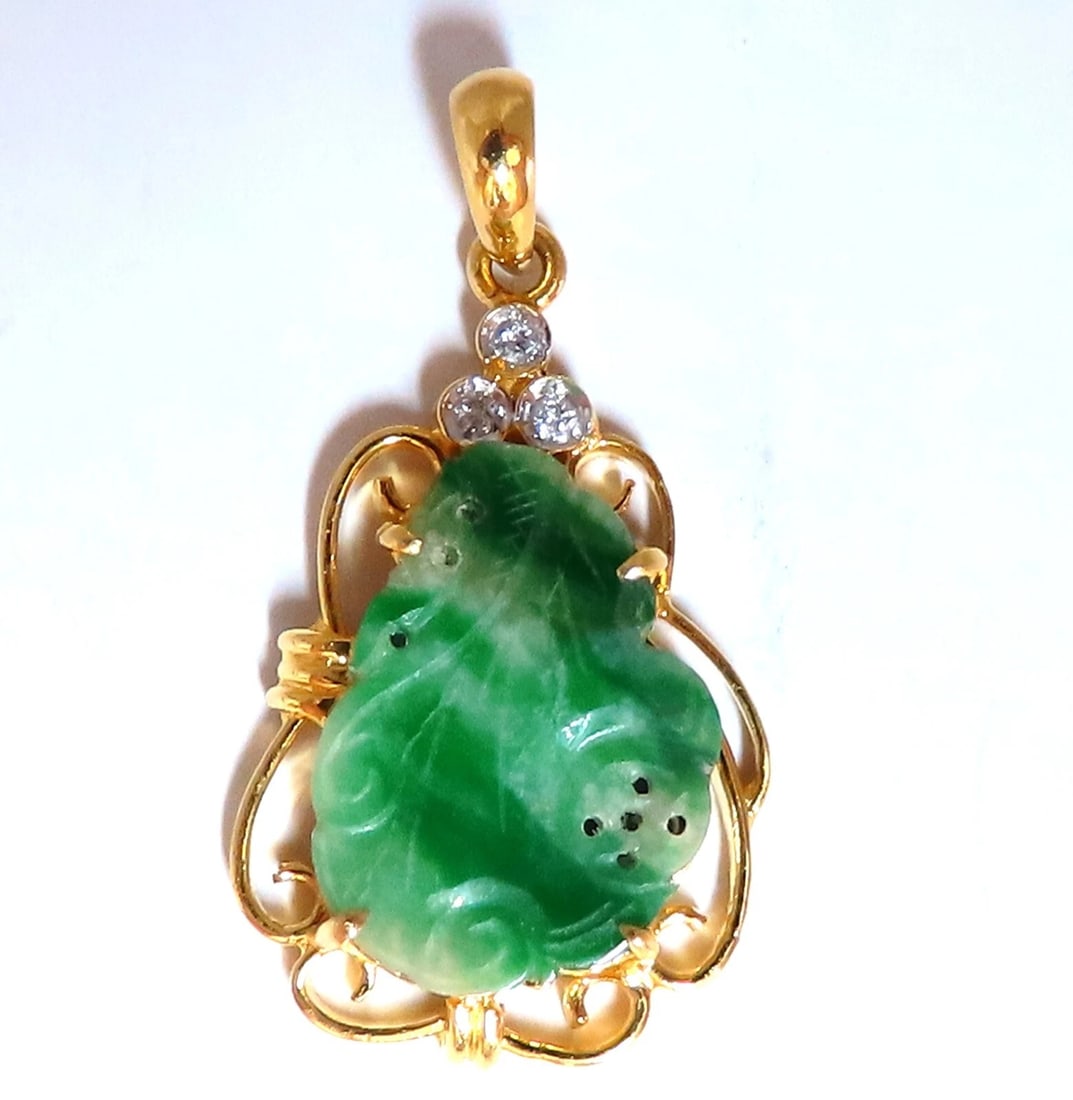 Natural Jade Carved Diamond Pendant 18kt**: Title: Natural Jade Carved Diamond Pendant 18kt** Description: Jade Pendant Apple Green color. 16 x 12mm .06ct Natural Round Diamonds Overall: 25 x 16mm 18kt / 3.4 gramsAll Items come with a Free Whit