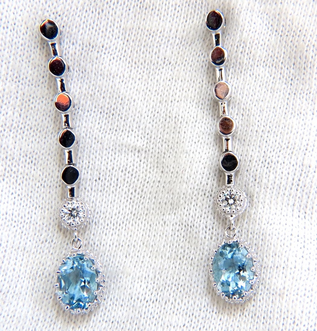 2.60ct natural aquamarines diamonds dangle earrings 14kt**: Title: 2.60ct natural aquamarines diamonds dangle earrings 14kt** Description: Aqua Dangles. 2.42ct. Natural Blue Aquamarines & .18ct. Natural diamonds earrings. Brilliant oval cut Aquamarines, Clean