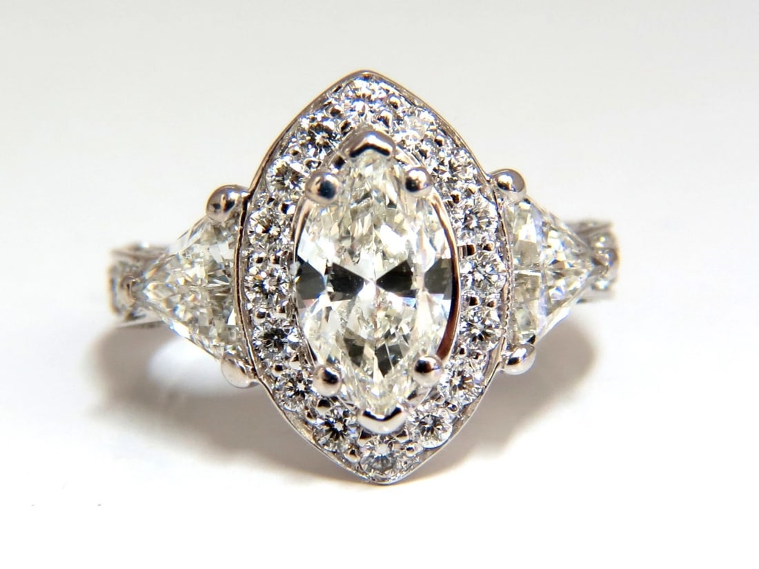 2.51ct Marquise Halo Natural Diamond Ring 14 Karat **: Title: 2.51ct Marquise Halo Natural Diamond Ring 14 Karat ** Description: MAGNIFICENT JEWELS Marquise Mod Halo 1.01ct. Marquise diamond Ring I-color, Si-1 clarity 9 x 5.5mm .70ct (2) Side Trilliant cu