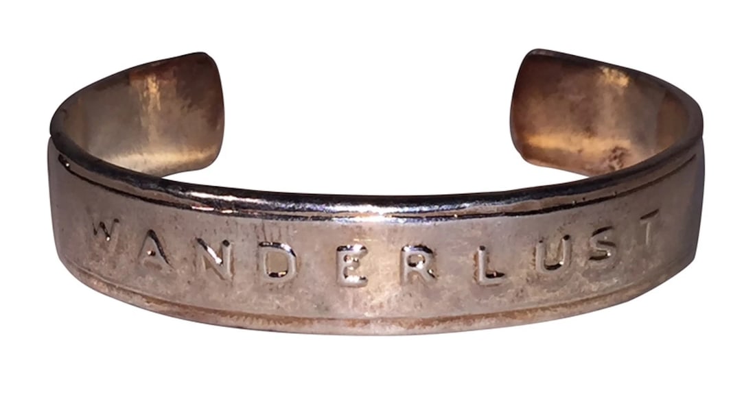 Bing Bang WonderLust Brass Cuff: Title:Bing Bang WonderLust Brass Cuff Description:Amazing, 14 kt rose gold plated over brass cuff from Bing Bang with embossed word, Wonder Lust. Circa, 2015. Cuff has the internal diameter of 2 3/8&r