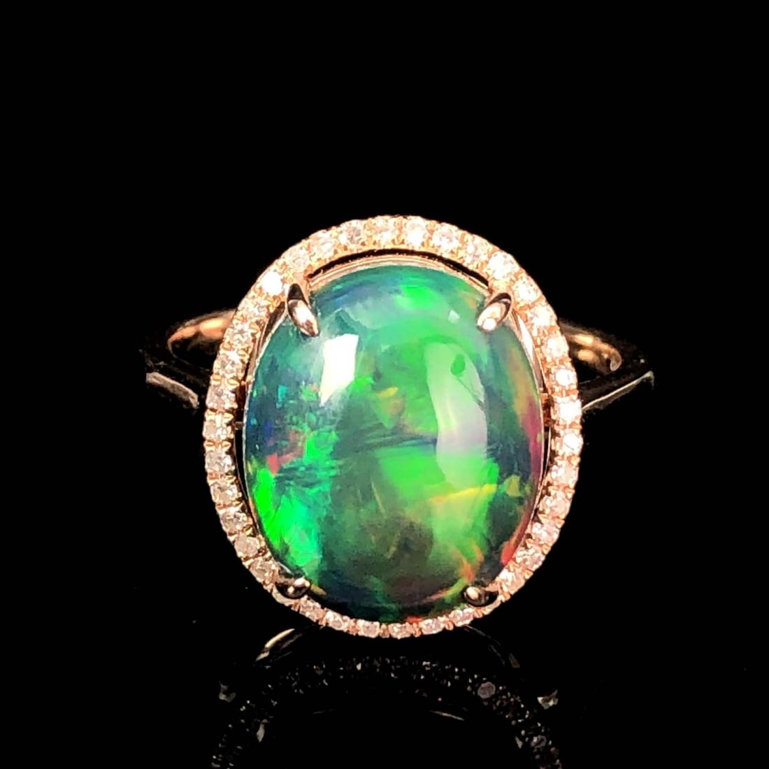 14K GOLD 3.95 CT NATURAL OPAL & DIAMOND RING: Title:14K GOLD 3.95 CT NATURAL OPAL & DIAMOND RING Description:Ref:230655308Gold Content:14K GoldRing Size:7.25USMain Gemstone:OpalNumber of stones:1Shape:OvalCarat Weight:3.95ct Color:BlackTreatment: