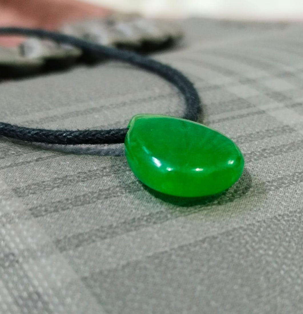 Green Jade Pear Pendant With Adjustable Black Cord: Title: Green Jade Pear Pendant With Adjustable Black Cord Description: Pendant Detail Design : Pear Pendant With Adjustable Black Cord Stone Name : Green Jade Color : Green Measurment : 18x25 MM Shape