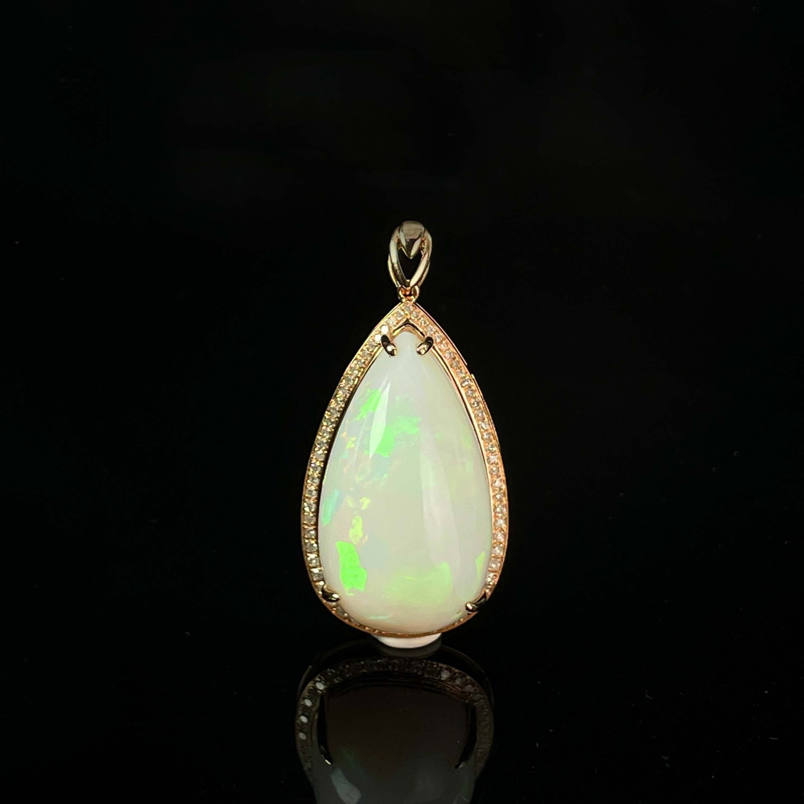 14K GOLD 20.3 CT NATURAL OPAL & DIAMOND PENDANT: Title:14K GOLD 20.3 CT NATURAL OPAL & DIAMOND PENDANT Description:Ref:230655316Gold Content:14K GoldMain Gemstone:OpalNumber of stones:1Shape:PearCarat Weight:20.3ct Color:WhiteTreatment:NaturalCut Gr