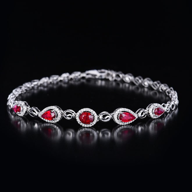 14K GOLD 1.43 CTW VIVID RED NATURAL RUBY & DIAMOND BRACELET: Title:14K GOLD 1.43 CTW VIVID RED NATURAL RUBY & DIAMOND BRACELET Description:Ref:230655287Gold Content:14K GoldMain Gemstone:RubyShape:PearCarat Weight:1.2ct Color:Vivid RedTreatment:NaturalCut Grade