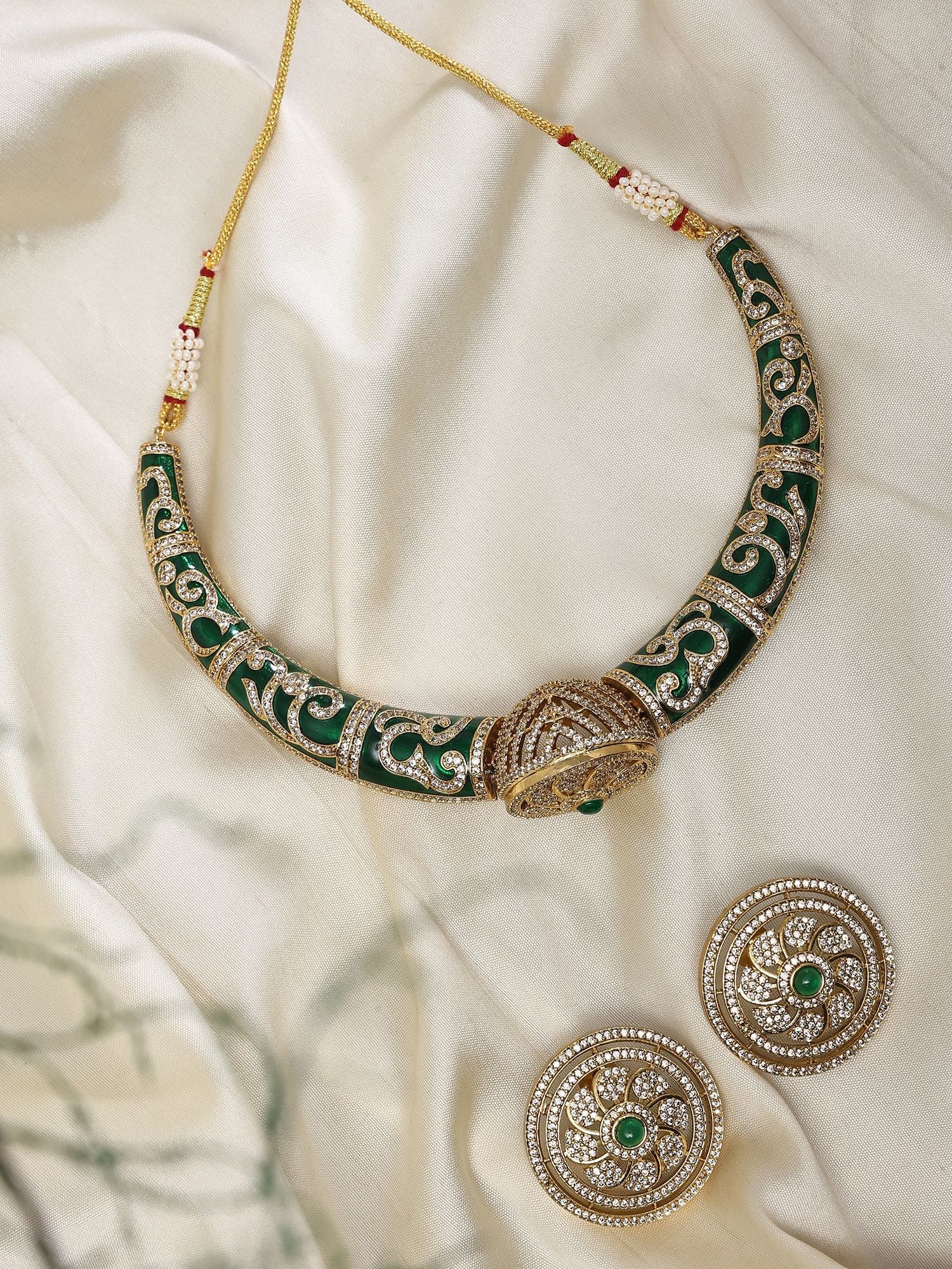 Green Stone Studded Rajasthani Style Hasli Necklace with Stud Earrings: Title:Green Stone Studded Rajasthani Style Hasli Necklace with Stud Earrings Reference:itemcode : JA0445 Reserve: $76.00 Shipping: Domestic: Shipping rates are determined by destination