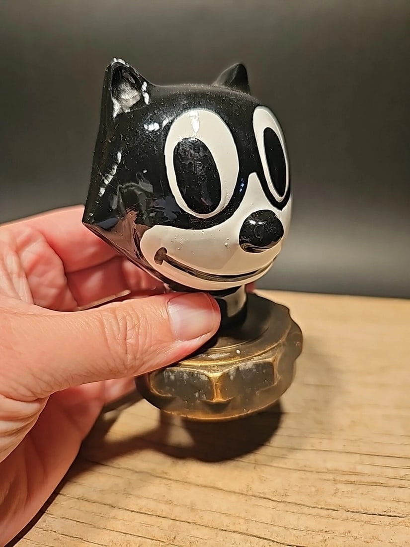 Iron Felix Figure Radiator Cap Statue: 4 1/4" Tall 2 1/2" Wide Such a neat iron statue radiator cap! As you can see this heavy cast iron cap was wonderfully hand painted cast iron with brass threaded base. Very solid! Looks great on