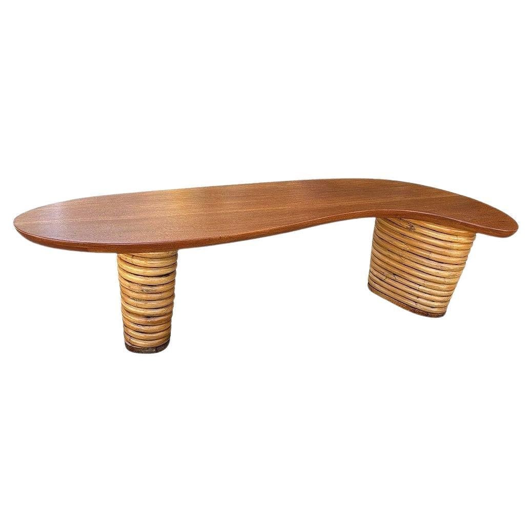 Restored Stacked Rattan Biomorphic Surfboard Coffee Table w/ Koa Wood Top: Title: Restored Stacked Rattan Biomorphic Surfboard Coffee Table w/ Koa Wood Top Description: This beautifully restored biomorphic rattan table has a striking Paul Frankl-inspired mid-century design. 
