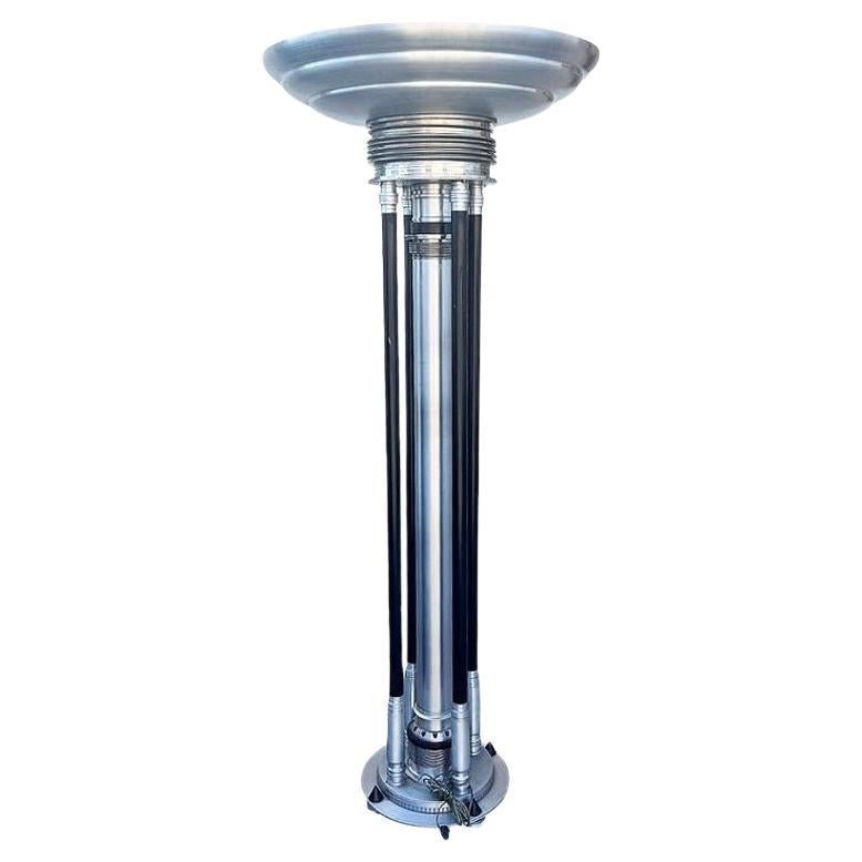 Large Machine Age Art Deco Revival Aluminum and Steel Floor Lamp, 1980: Title: Large Machine Age Art Deco Revival Aluminum and Steel Floor Lamp, 1980 Description: Renowned artist Rick Ramirez fashioned distinctive, towering floor lamps in the Art Deco style, each a