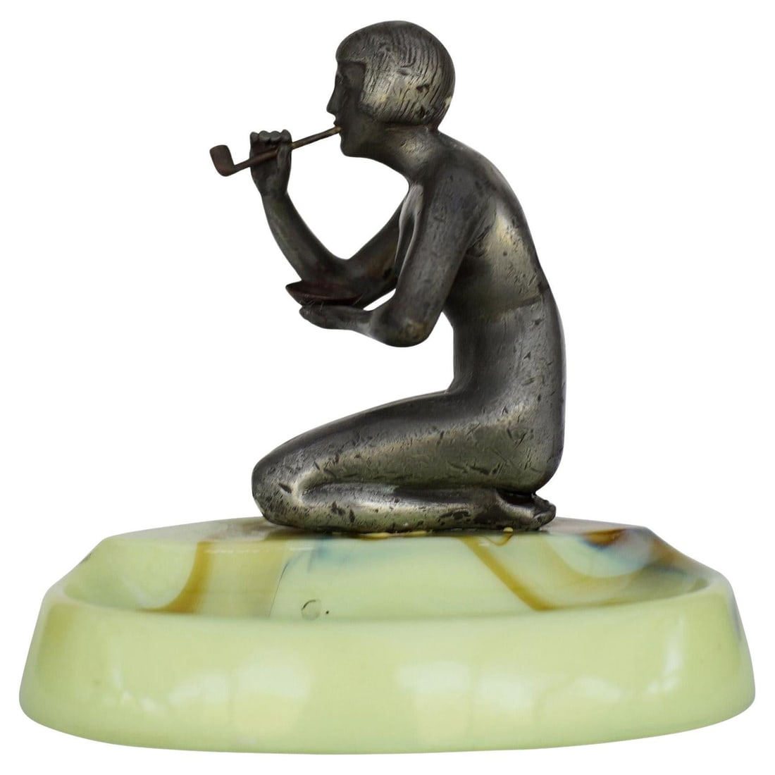 Nude Art Deco Smoking Flapper Slag Glass Ashtray by Houzex: Title: Nude Art Deco Smoking Flapper Slag Glass Ashtray by Houzex Description: Made by Houzex, this brown and green slag ashtray features a spelter metal sculpture of a nude flapper girl smoking a
