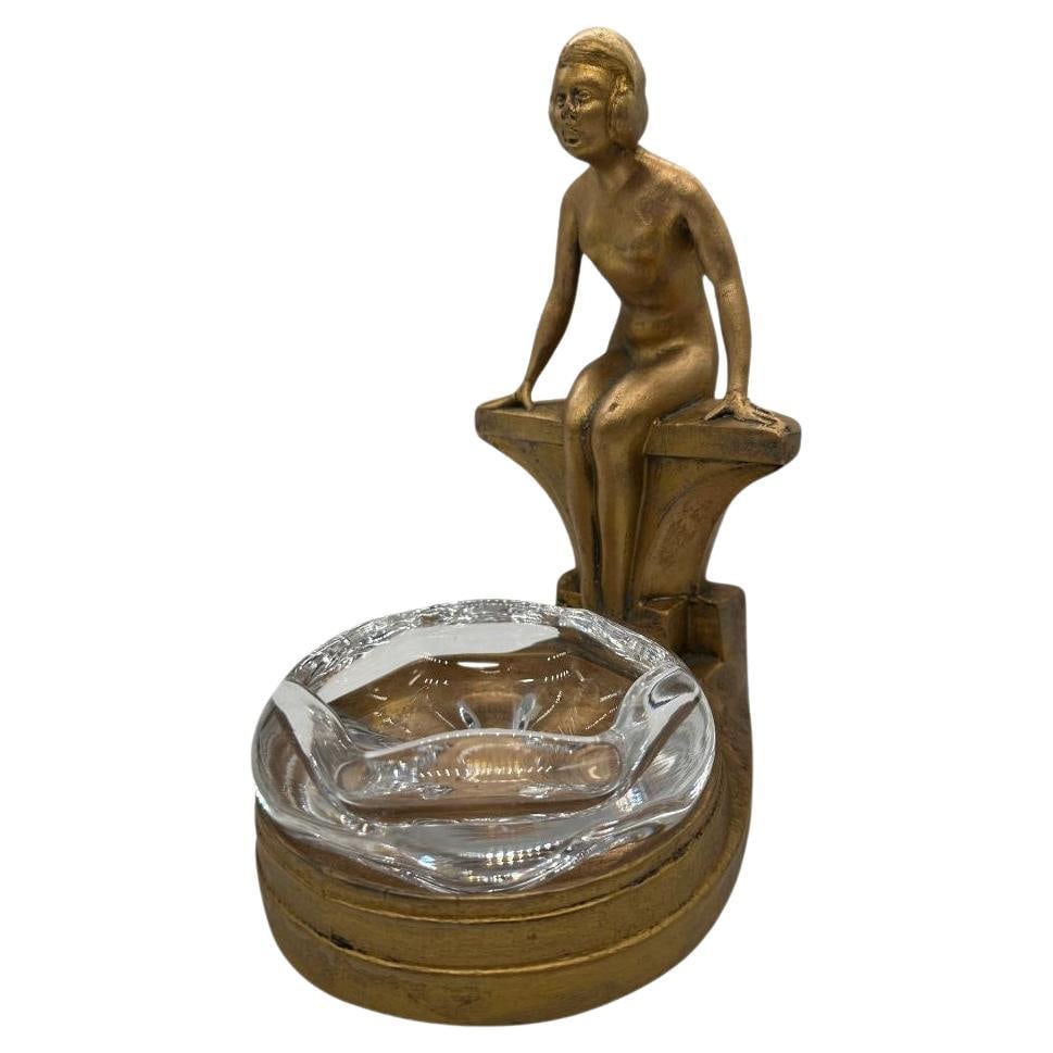 Art Deco Nude Woman Seated at Pool Bronze & Crystal Sculpter Ashtray by Nuart: Title: Art Deco Nude Woman Seated at Pool Bronze & Crystal Sculpter Ashtray by Nuart Description: A Stunning Art Deco figural female nude gracefully sitting by a pool with a crystal glass ashtray by N