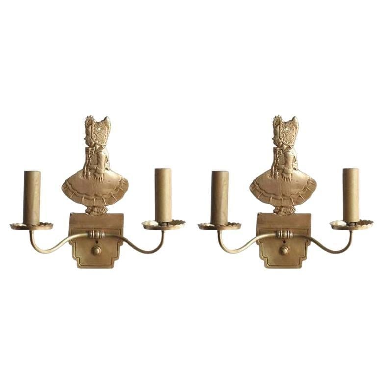 Bronze Electric Candelabra Wall Sconce with Girl in Bonnet, Pair: Title: Bronze Electric Candelabra Wall Sconce with Girl in Bonnet, Pair Description: Pair of vintage circa 1947 solid bronze electric candelabra wall sconces featuring a young girl in bonnet used in