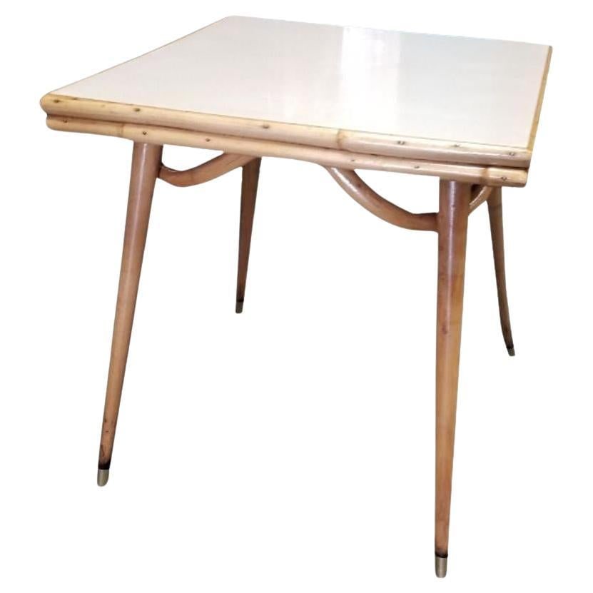 Rare Restored Rattan Single Strand Tappered Leg Dining Table: Title: Rare Restored Rattan Single Strand Tappered Leg Dining Table Description: This beautifully restored Paul Frankl-inspired Mid-century single-strand rattan dining table. The table is made with a