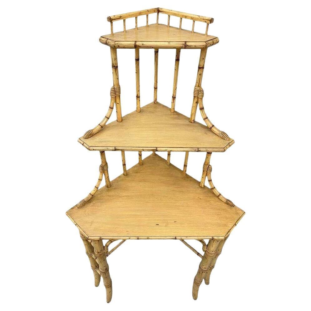 Mid-century James Mount Style 3-Tiered Blonde Bamboo Corner Shelf: Title: Mid-century James Mount Style 3-Tiered Blonde Bamboo Corner Shelf Description: James Mont inspired Asian-inspired three-tiered bamboo Corner Shelf featuring a blonde wood finish that enhances