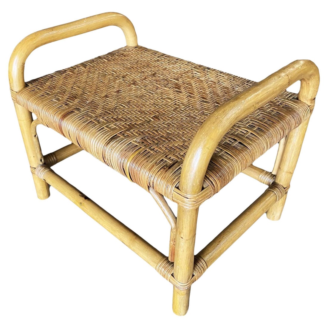 Restored Single Stand Rattan Staple Side Ottoman Stool W Woven Wicker Seat: Title: Restored Single Stand Rattan Staple Side Ottoman Stool W Woven Wicker Seat Description: Restored 1950s rattan vanity stool with wicker seat featuring a "staple" rattan base. 1950, United