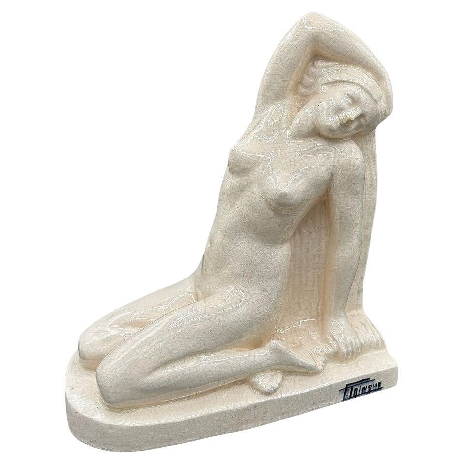 French Art Deco Nude Female Ceramic Sculpture signed by F. Trinque: Title: French Art Deco Nude Female Ceramic Sculpture signed by F. Trinque Description: Original Art Deco nude ceramic sculpture featuring a figural study of a young female form with an early